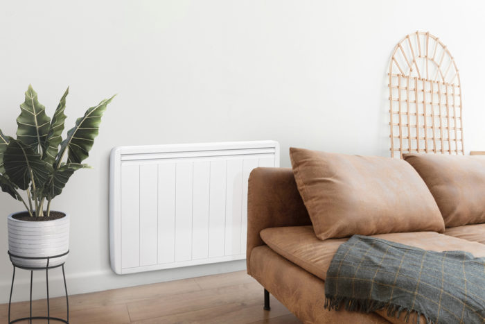 salon avec plante et canape beige -radiateur electrique performant en arriere plan